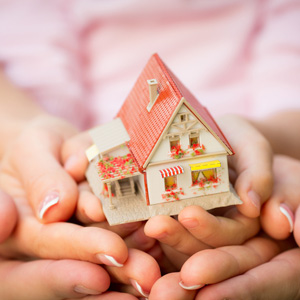 Child & Parent Holding small House